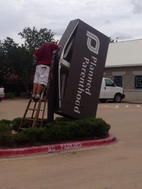 Former Bryan Planned Parenthood Clinic Sign Being Taken Down.
